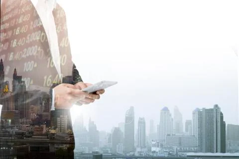 Businessman using tablet analyzing sales data and economic growth graph chart Stock Photos