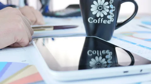 Businessman using Tablet And drinking Coffee Stock Footage 64058029