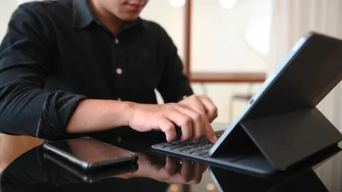 Businessman using on tablet and smartphone  at home office as concept.busines Stock Footage 202063681