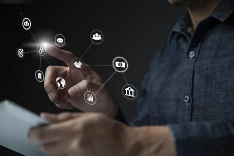 Businessman using tablet and virtual touch screen to online transactions with Stock Photos
