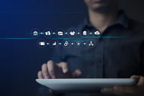 Businessman using tablet and virtual touch screen to online transactions with Stock Photos