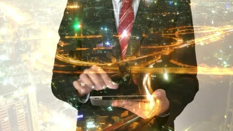 Businessman Using Tablet with Cityscape Background and Digital Overlay Stock Footage 315975522