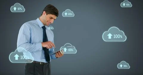 Businessman using tablet with cloud computing icons, analyzing data trends Foto stock