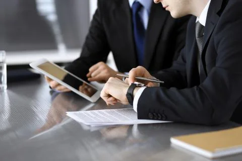 Businessman using tablet computer and work together with his colleague or Foto stock