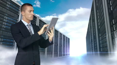 Businessman using tablet computer in front of server tower on sky background Stock Footage 52015719
