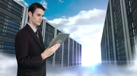 Businessman using tablet computer in front of server tower on sky background Stock Footage 52015760