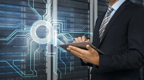 Businessman using tablet computer in front of server tower Stock Footage 52015982
