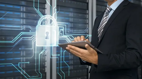 Businessman using tablet computer in front of locked server tower Stock Footage 52016014