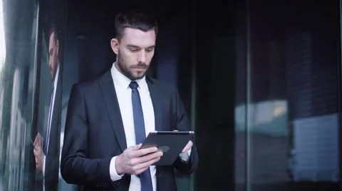 Businessman Using Tablet Computer Outdoors Stock Footage 67424253
