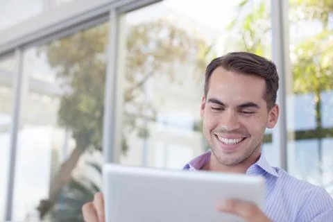 Businessman using tablet computer outdoors Foto stock