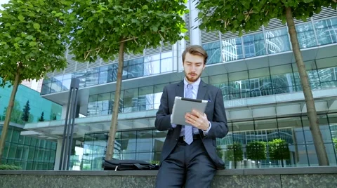 Businessman is using tablet computer (slider shot) Stock-Footage 67583325