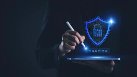 Businessman using tablet with cybersecurity shield and padlock icon. Data p.. 写真素材