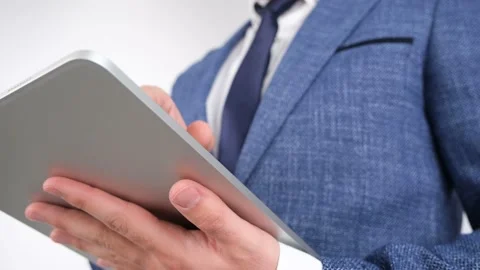Businessman using tablet Stockbeeldmateriaal 236196235