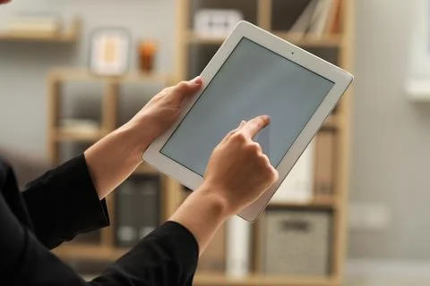 Businessman using tablet in office, closeup. Modern technology 스톡 사진