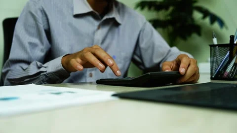 Businessman Using Tablet at Office Desk, Businessman using a tablet at an o.. Stock Footage 348345669