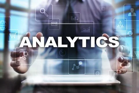 Businessman using tablet pc and selecting analytics. 스톡 사진