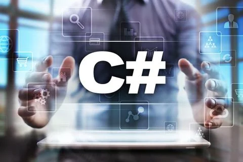 Businessman using tablet pc and selecting c#. Stock Photos