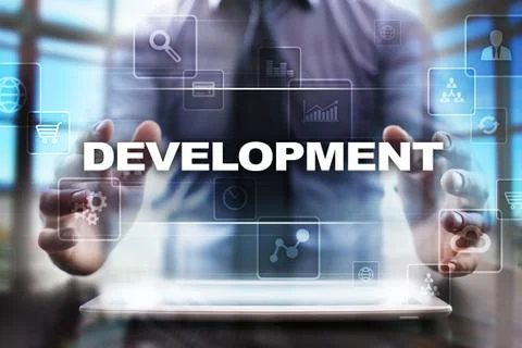 Businessman using tablet pc and selecting development. Stock Photos