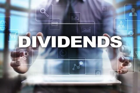 Businessman using tablet pc and selecting dividends. Fotos Stock