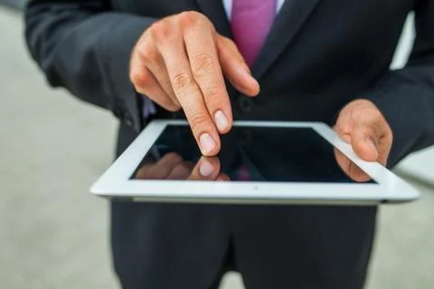 Businessman using tablet pc. Close up. Stock Photos