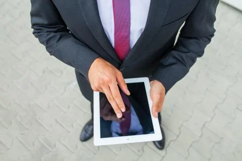 Businessman using tablet pc. Close up. Stock Photos