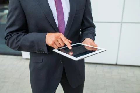 Businessman using tablet pc. Close up. Stock Photos