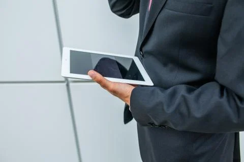 Businessman using tablet pc. Close up. Stock Photos