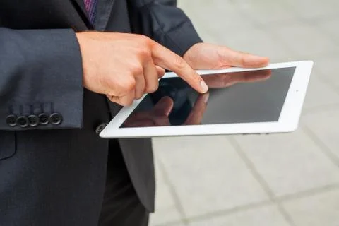 Businessman using tablet pc. Close up. Stock Photos