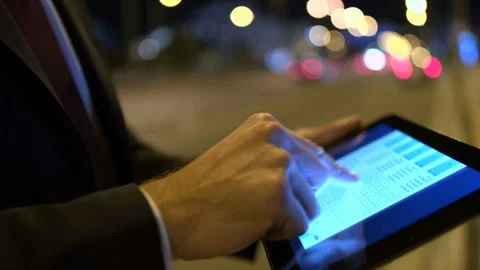 Businessman using tablet at the street Stock Footage 210463048