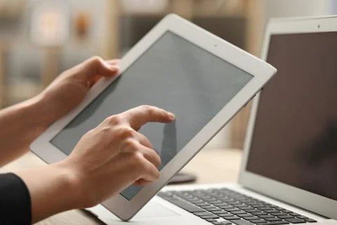 Businessman using tablet at table, closeup. Modern technology Foto stock