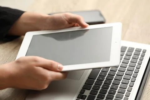 Businessman using tablet at table, closeup. Modern technology Foto stock