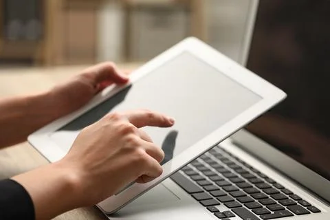 Businessman using tablet at table, closeup. Modern technology 스톡 사진