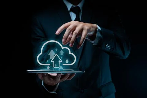 Businessman using tablet for upload. Stock Photos