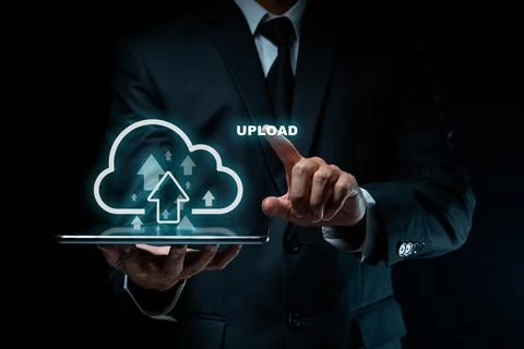 Businessman using tablet for upload. Stock Photos