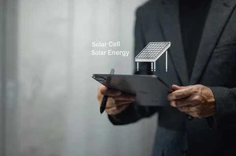 Businessman Using Tablet with Virtual Solar Cell Illustration for Renewable.. Stock Photos