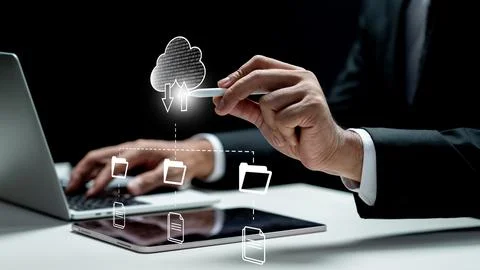 Businessman using tablet while touching cloud network icon from tablet scre.. 写真素材