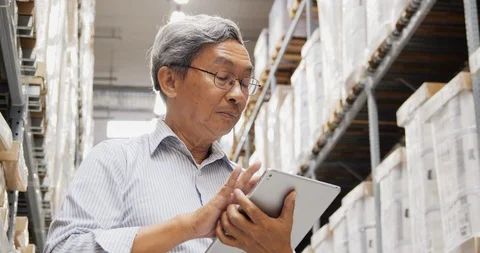 Businessman using tablet for working at warehouse. Stock Footage 116550502