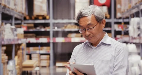 Businessman using tablet for working at warehouse. 스톡 동영상 116553425