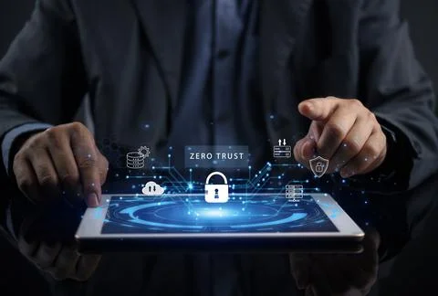 Businessman using tablet with Zero Trust security interface, padlock icon, .. Stock Photos