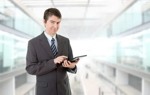 Businessman using touch pad of tablet pc, at the office Stock Photos