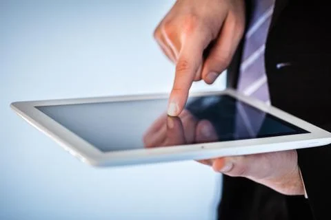 Businessman using touchscreen on tablet Stock Photos