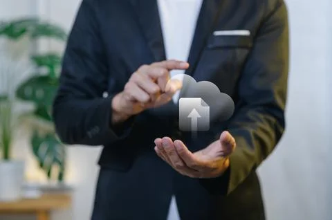 Businessman Using Touchscreen Technology to Upload Cloud Data in Office Stock Photos
