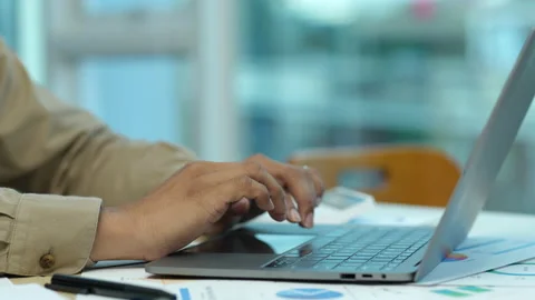 Businessman using typing laptop computer in the office, business at work Stock Footage 235971844