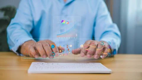 Businessman using virtual interface with futuristic charts, graphs, and dat.. Foto stock