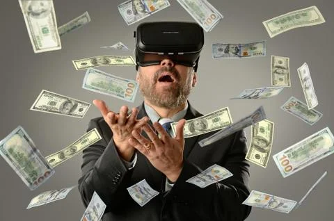 Businessman Using Virtual Reality Getting Money Stock Photos