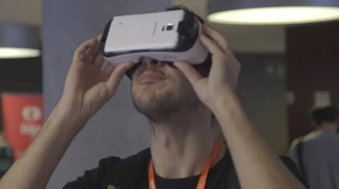 Businessman using virtual reality headset Stock Footage 64565523