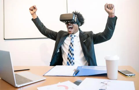 Businessman using virtual reality headset Stock Photos