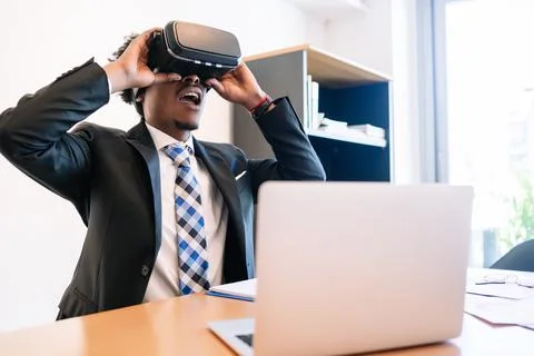 Businessman using virtual reality headset Stock Photos