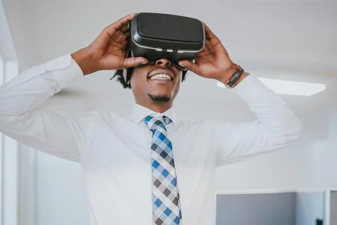 Businessman using virtual reality headset Stock Photos