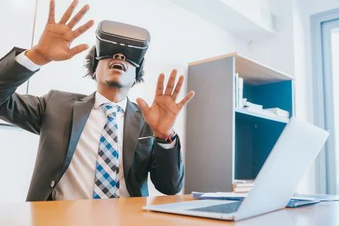 Businessman using virtual reality headset Stock Photos